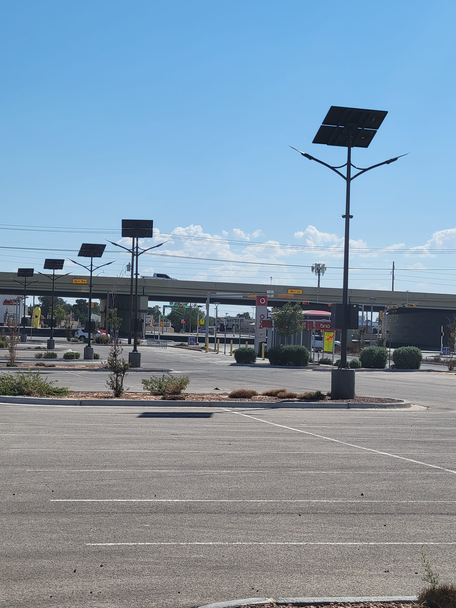 SolarPath dual-arm solar parking lot lights at a commercial site in El Paso, Texas