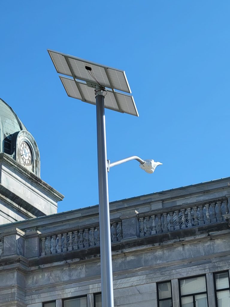 SolarPath solar street light beside a historic courthouse clock tower